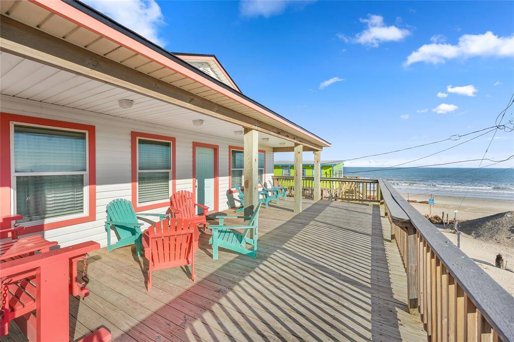 Steps away from the beach with two decks, ramp, golf cart garage, storage shed, outdoor shower, and incredible water views!