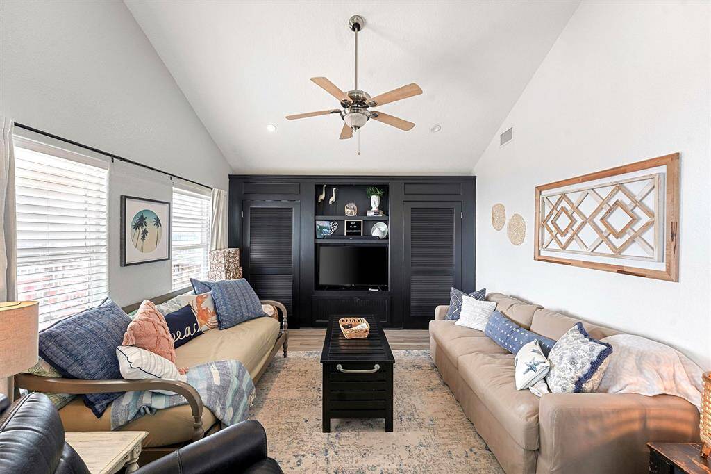 Vaulted ceilings, gorgeous built-in storage, open concept, and water views.