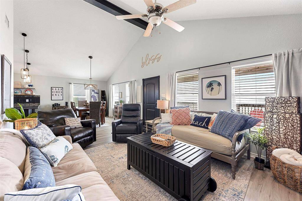 Vaulted ceilings, gorgeous built-in storage, open concept, and water views.