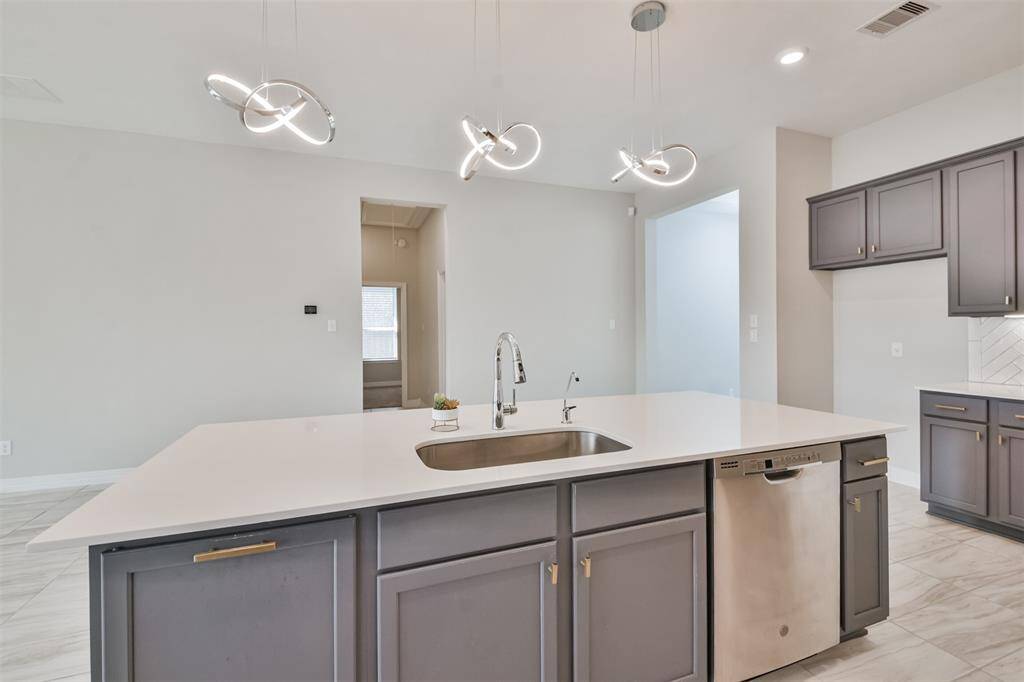 You will love the large deep pull out hidden trash cans.