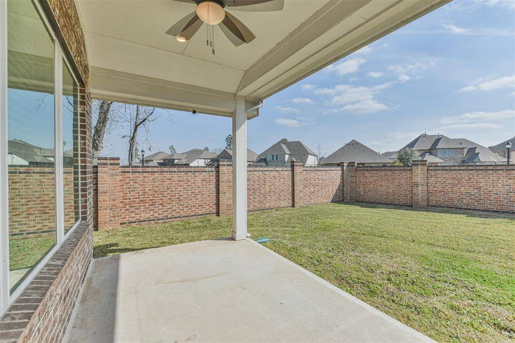Covered patio with fan.