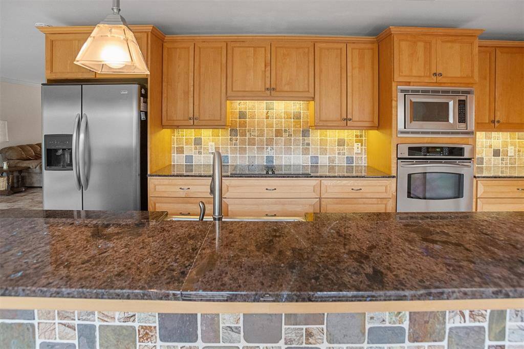 Tile backsplash and pendant lights.