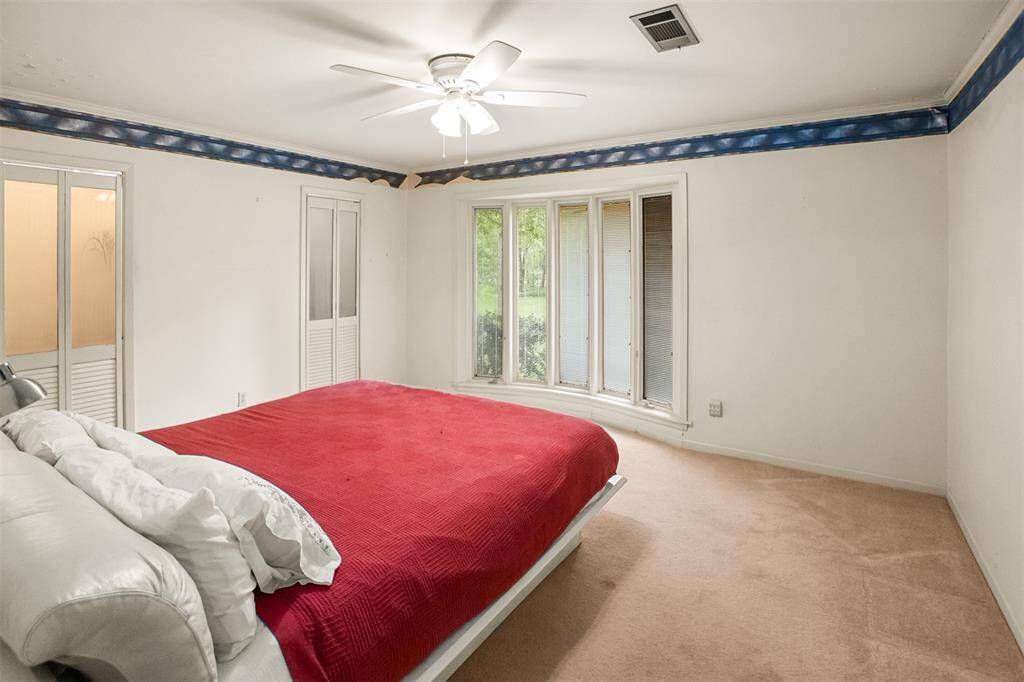 Primary bedroom. Split plan 2 bed on one side and two on other.
