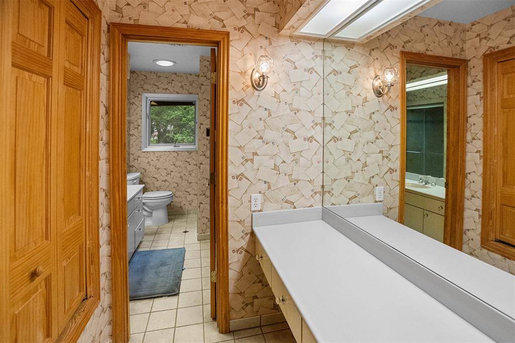 Primary bath with vanity area and stand up shower.