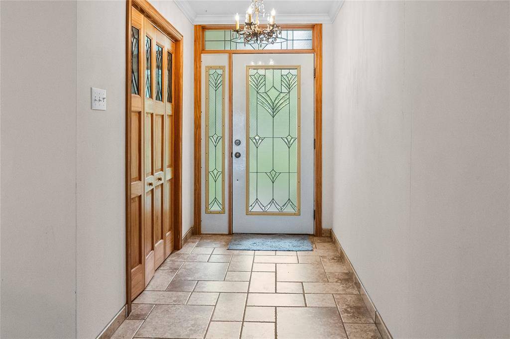 Private entry with leaded glass front door.