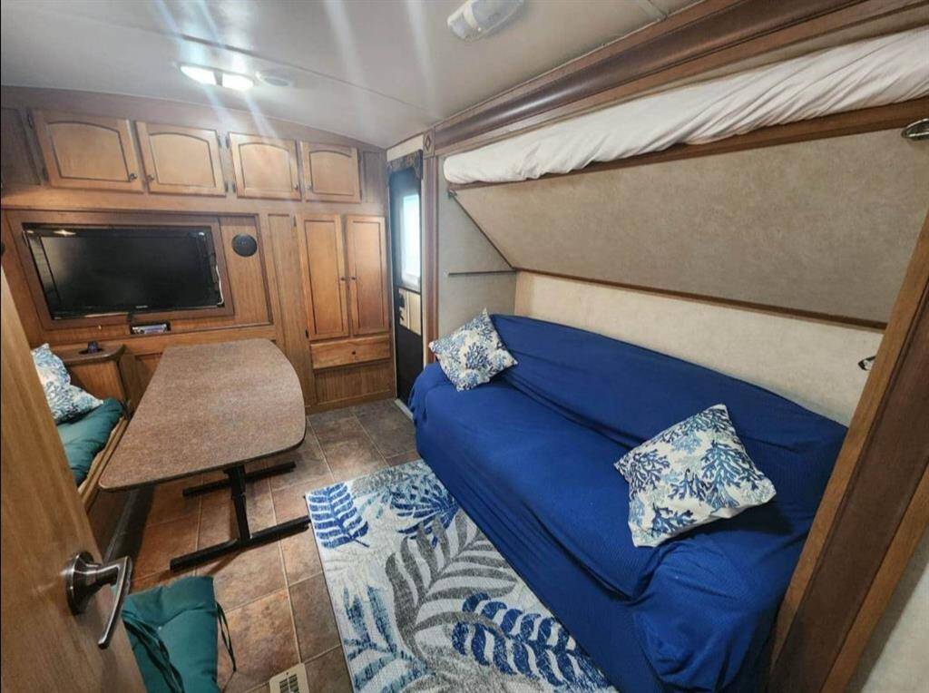 2nd bedroom with large dinette bench/table, sofa bed and pull down loft bed.