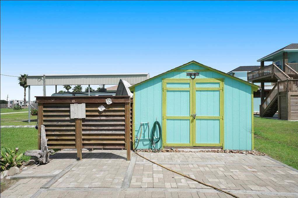 Outdoor shower and storage shed with w/d