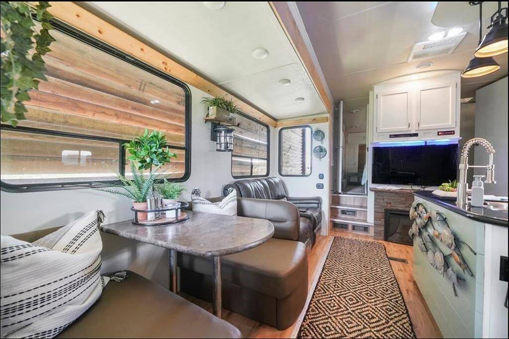 2 recliners, double booth dinette & electric fireplace. Loft bed (not pictured)