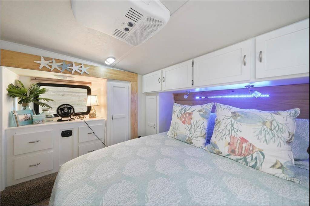 Bdrm 1 with dedicated AC, queen bed and built in storage