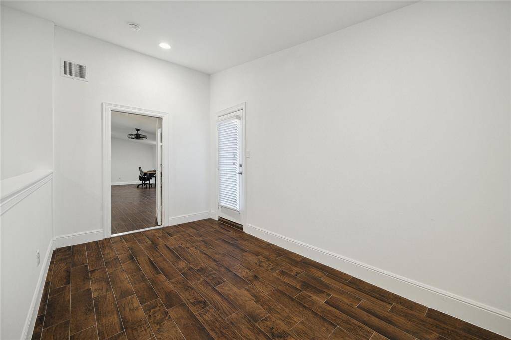4th level landing is 14x7. dark wood-like tile. could easily be used as a study or workout out space. right door exits to roof top patio.