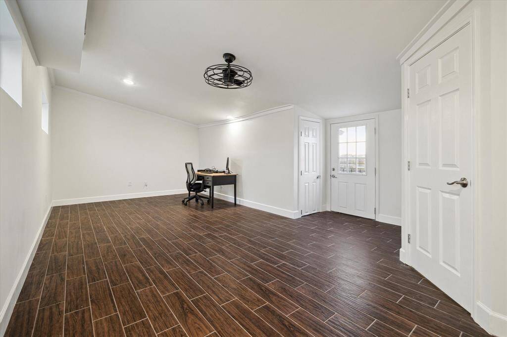 the 5th bedroom is 28x15 & located on the top level, wood-like tile floors, private bath, walk-in closet. from left to right, additional attic space, hvac access & far right door leads to bath. A nearly $18K+ build out.