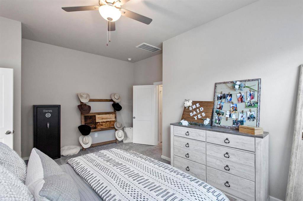 The primary suite has some extra space for a sitting area.