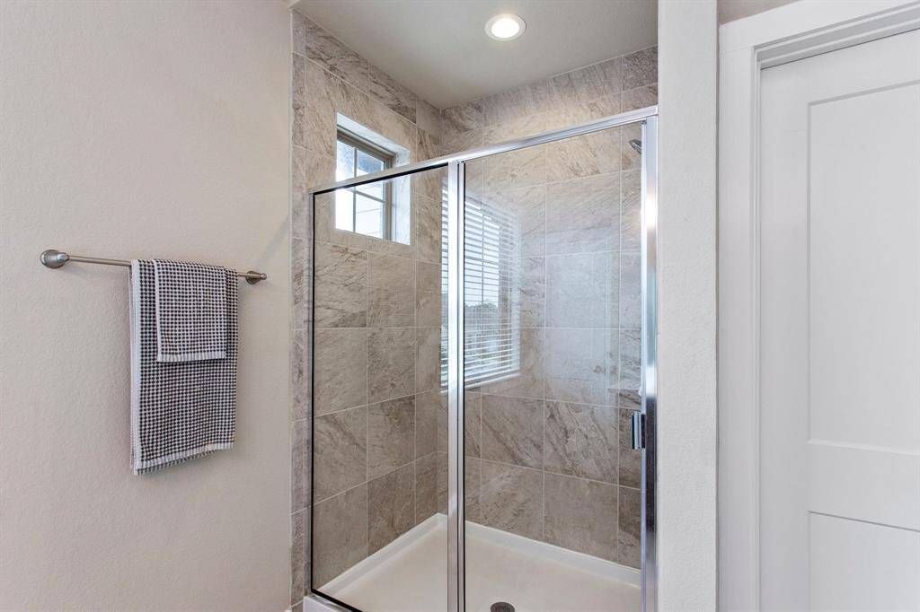 Oversized shower in the primary bathroom.