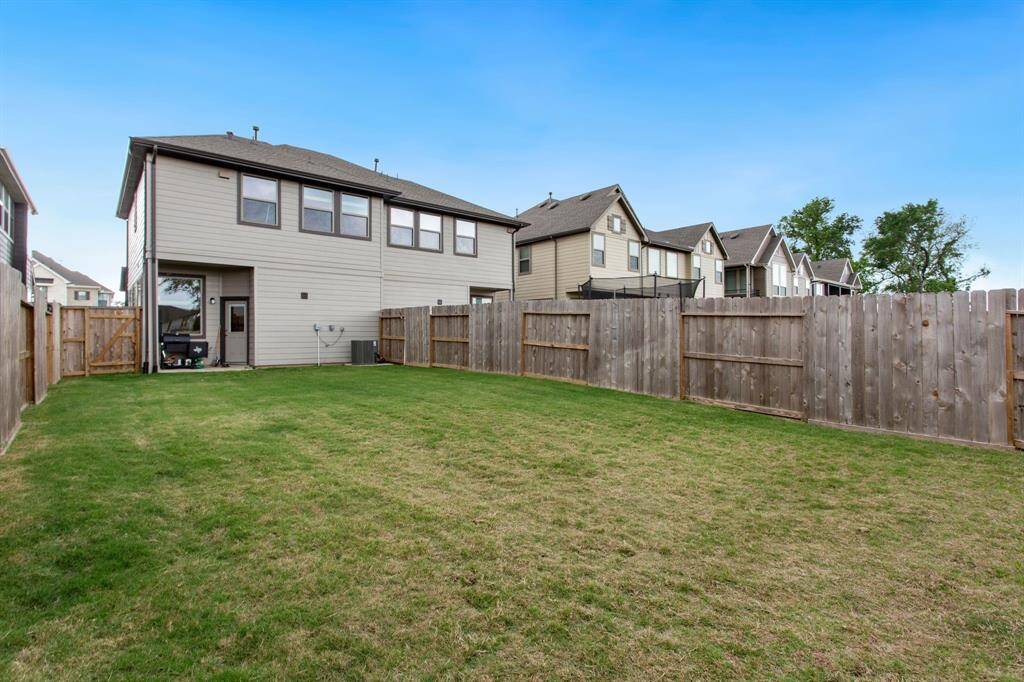 Large fenced backyard.  Note - this is a photo prior to adding a  backyard sitting area..