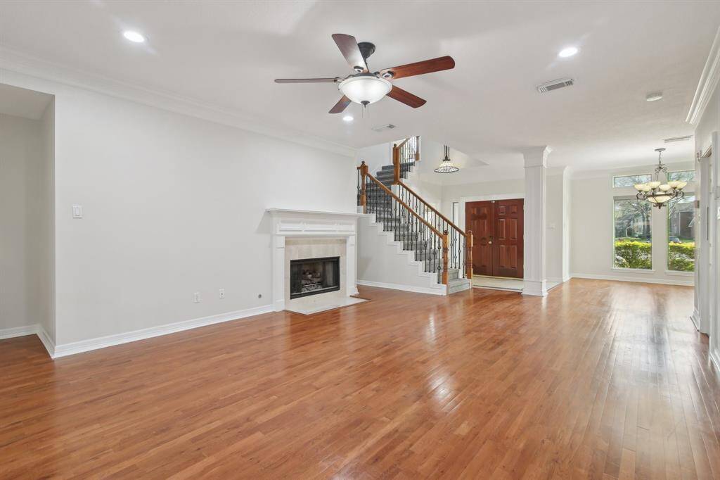Wood floors throughout family, dining and primary bedrooms.