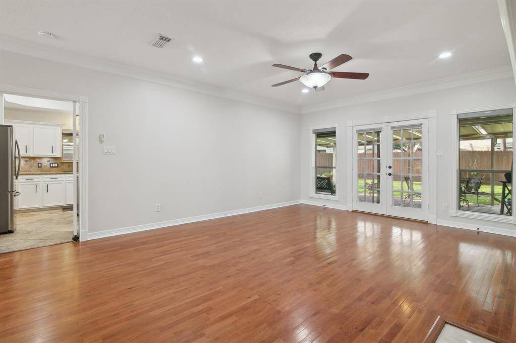 Great room for entertaining with french doors leading to covered patio.
