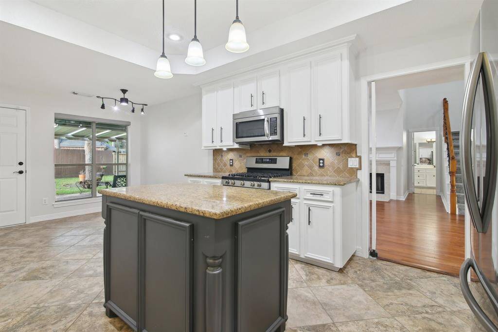 Kitchen also opens to back covered patio.