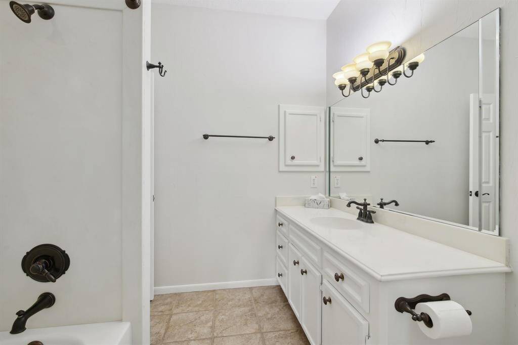 2nd full bath connected to guest bedroom.