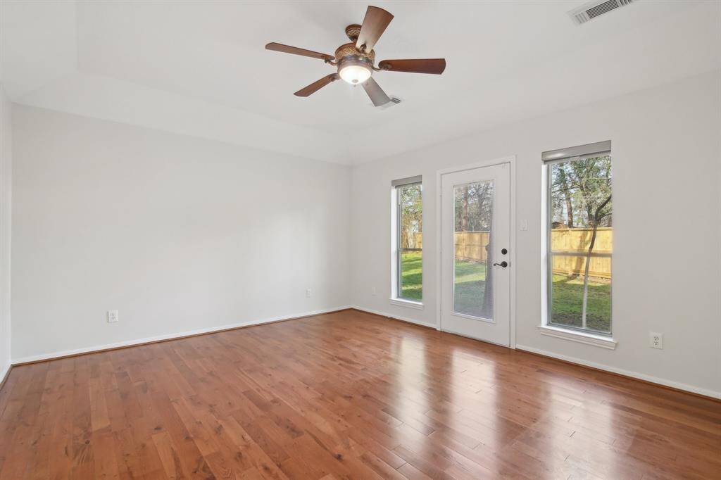 Primary bedroom on the first floor.  Private door to the back yard.