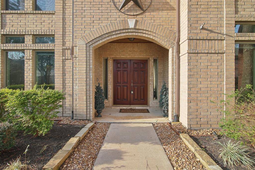 Arched entrance screams custom home builder.