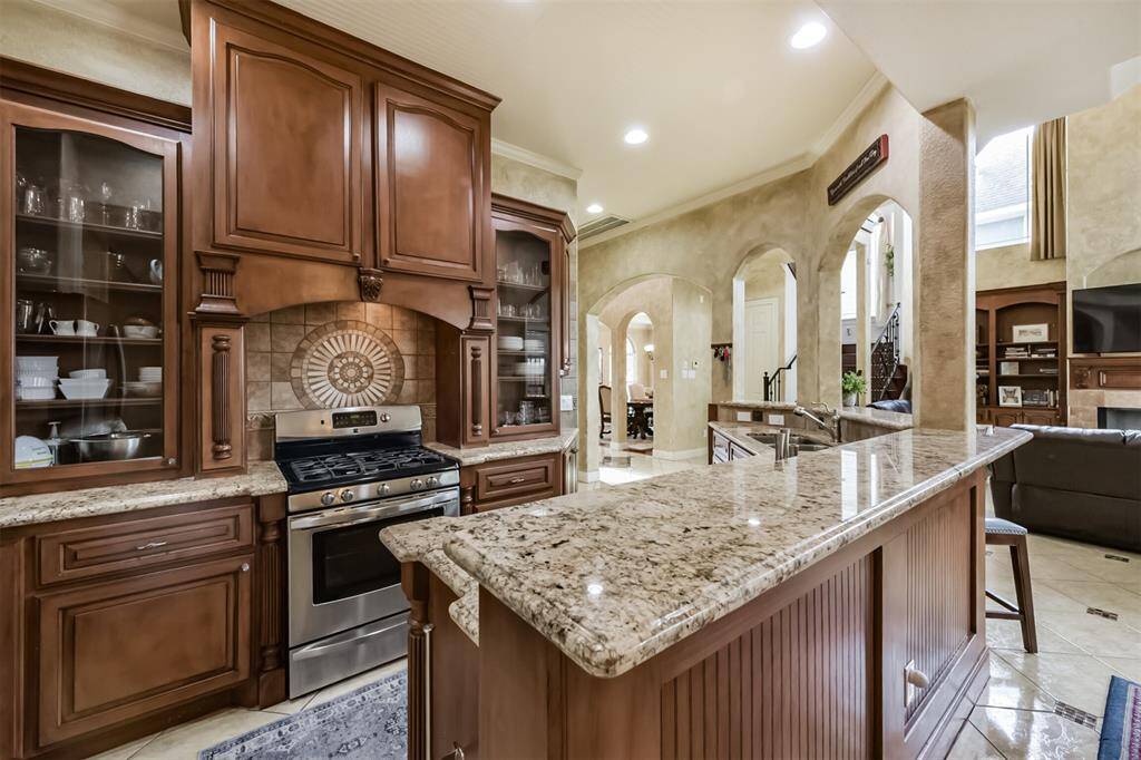 Custom cabinets, granite, and stainless appliances.