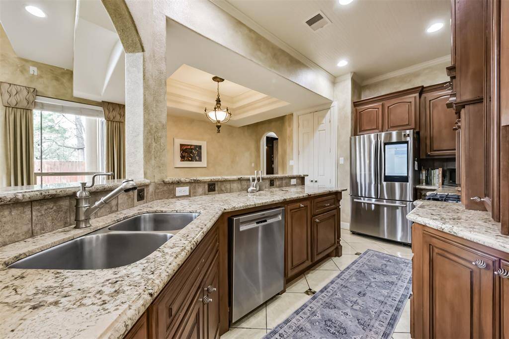 Large sink and great lighting.  Crown molding even in the kitchen.