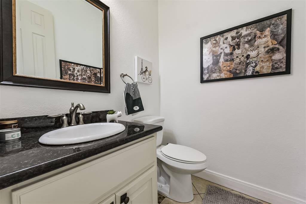 Half bath located near kitchen.