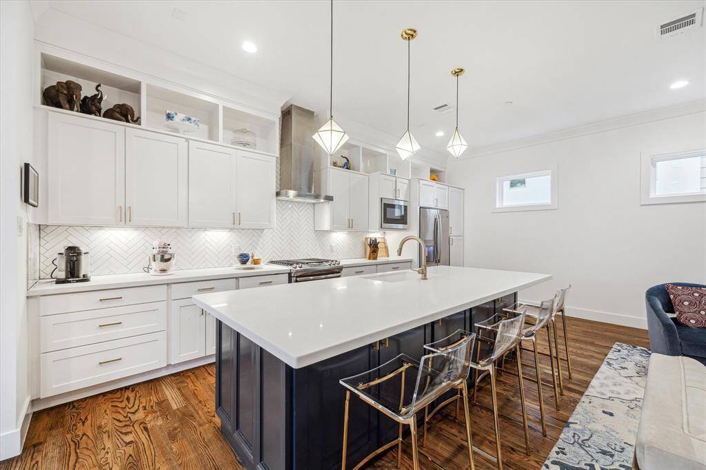 Chef kitchen with a pantry closet and pantry/appliance cabinet.