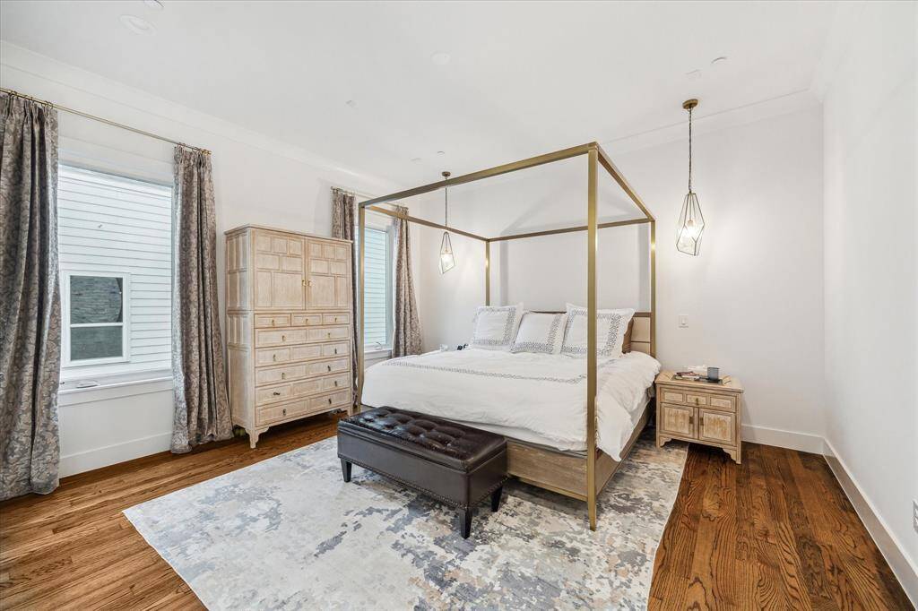 Primary bedroom is a great size and has two pendants on each size of the bed.