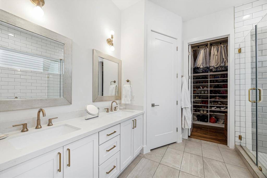 Primary bathroom has two sinks and a separate water closet
