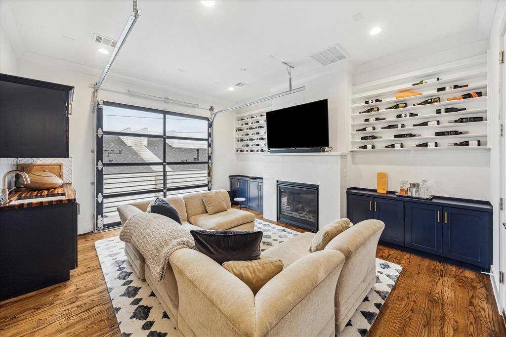 and it is great for entertainment. with a quartz fireplace with storage and built-ins for wine on each side.