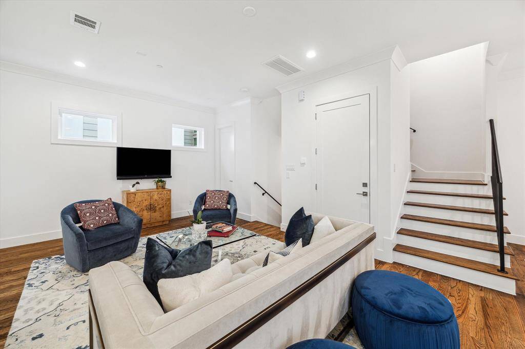 Living area space with a powder bath and the storage closet prepped for the elevator.