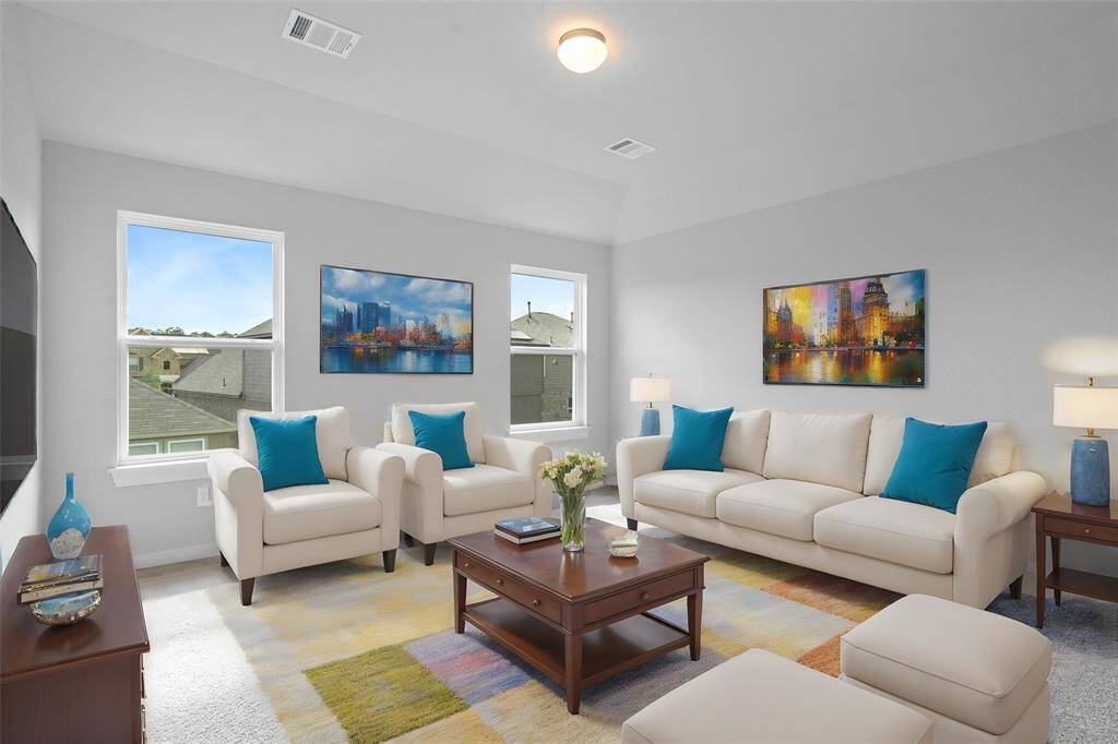 Come upstairs and enjoy a day of leisure in this fabulous game room! This is the perfect hangout spot or adult game room, this space features plush carpet, high ceiling, lighting, and custom paint!