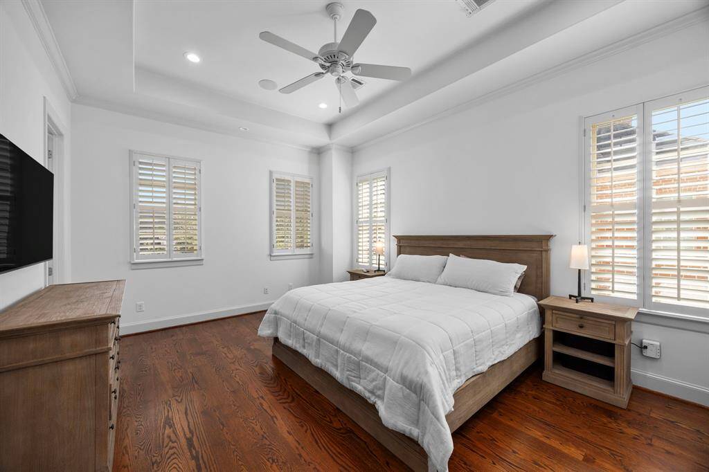 Primary ensuite bedroom oriented towards the front of the house.
