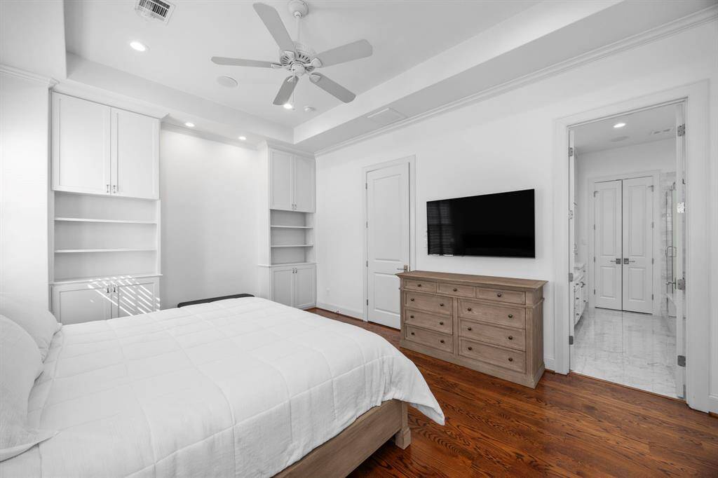 This room is light and bright. The space is maximized with the custom built-ins.