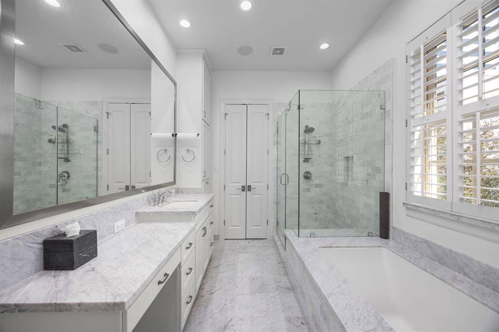 Timelessly sophisticated primary bathroom.