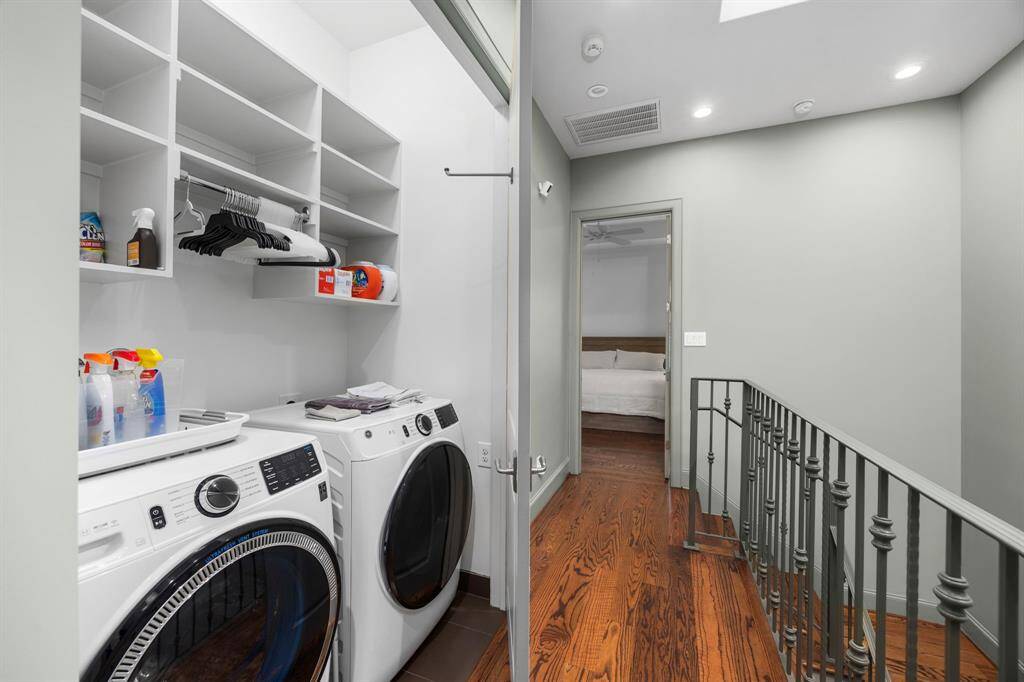 Laundry room is conveniently located off primary suite.