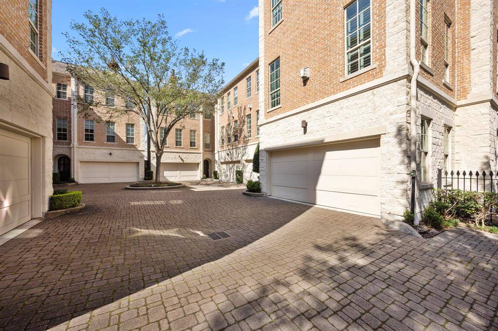 The gated entry leads you to the extra wide driveway.