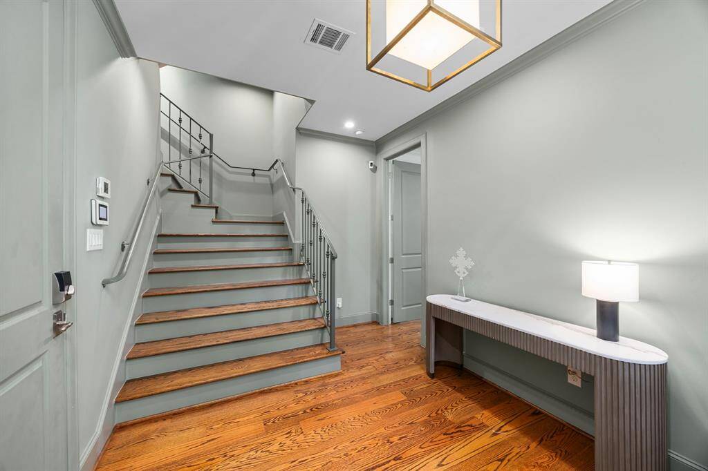 Foyer and grand staircase. First floor bedroom to the right.