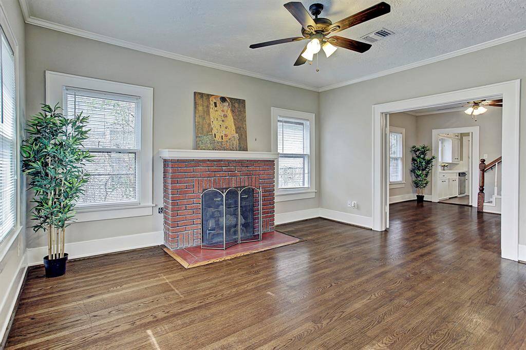 Reconditioned oversized windows & Rich hardwoods throughout