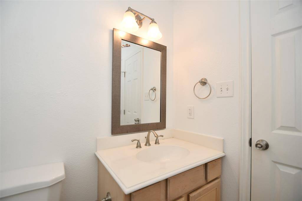 Elegant bathroom featuring a stylish vanity mirror.