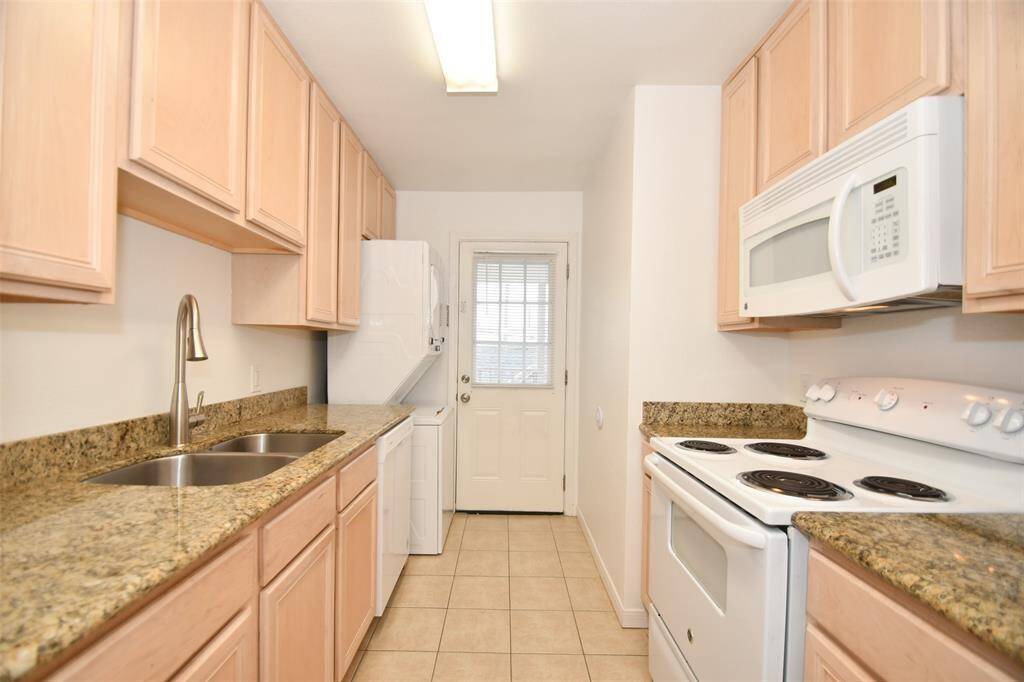 Functional kitchen with elegant granite countertops.