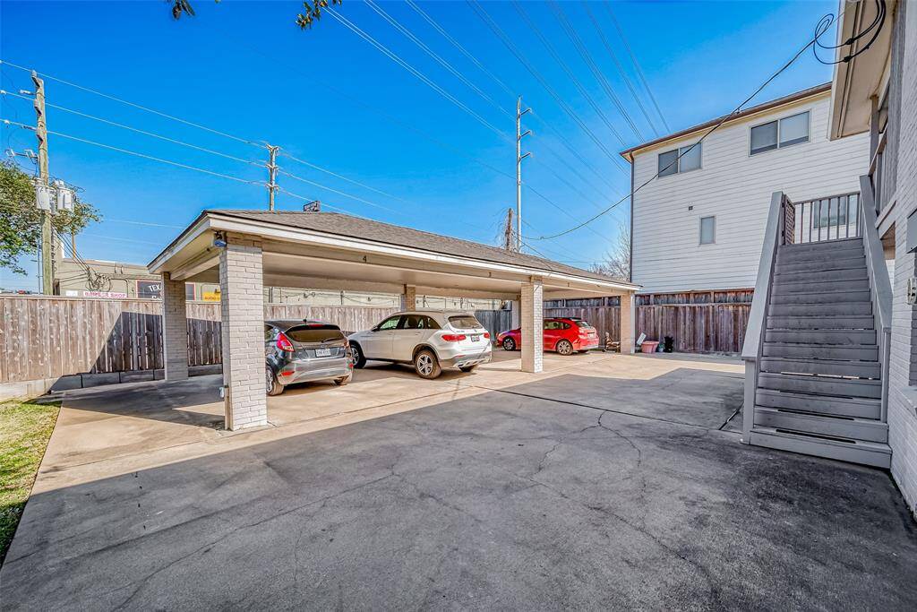 Modern carport (2013) offers convenient parking for each unit.