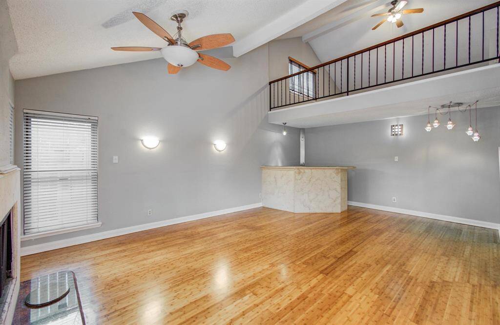 Living room/Den with vaulted Ceiling & Custom Wet Bar