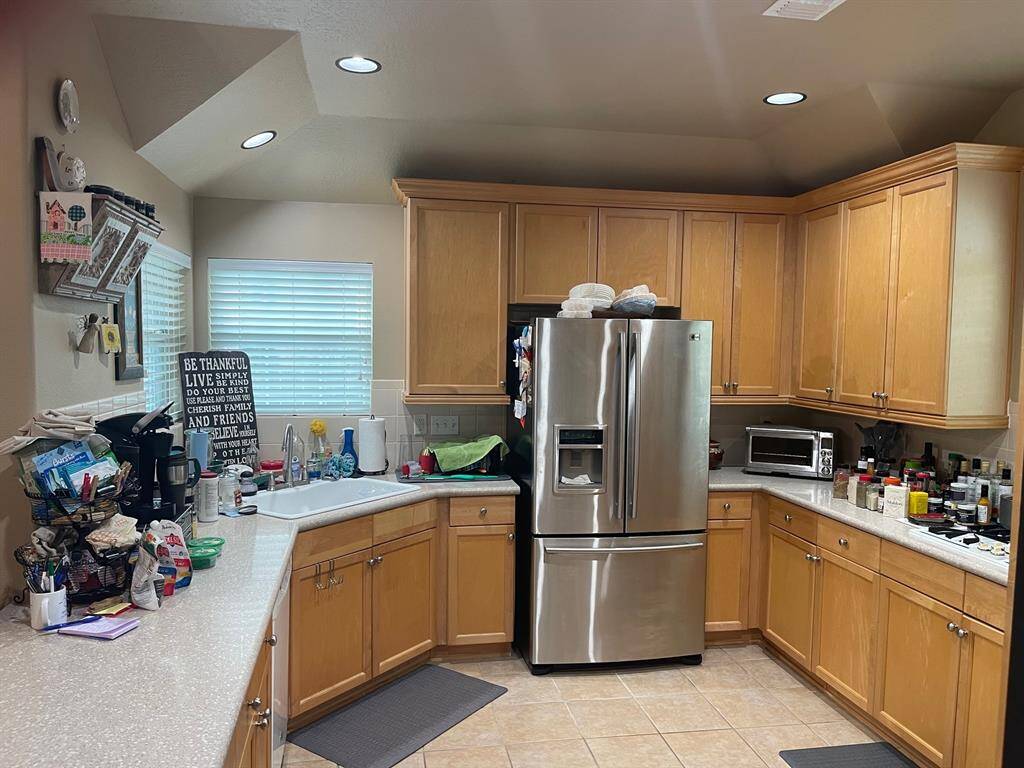 Again the large and abundant windows provide great natural light. Lots of countertop space for working and preparing meals.