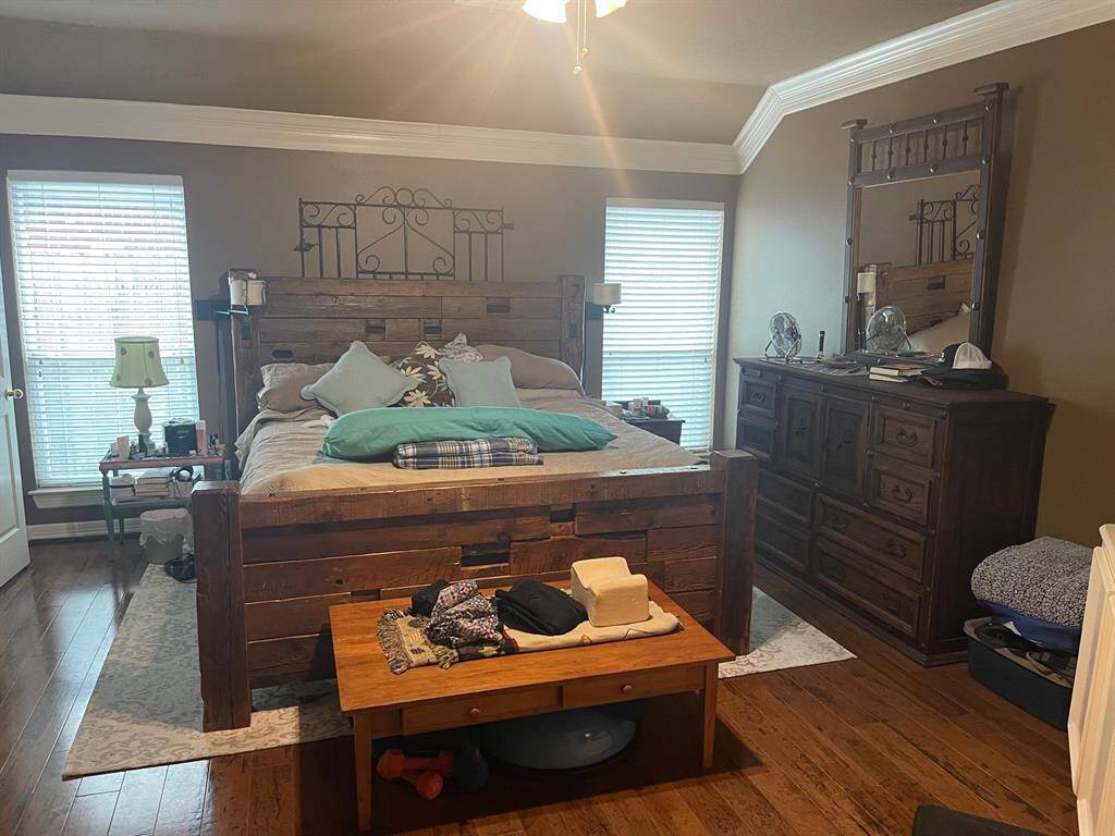 Master bedroom has the engineered wood floors and is spacious. The crown molding is gorgeous.