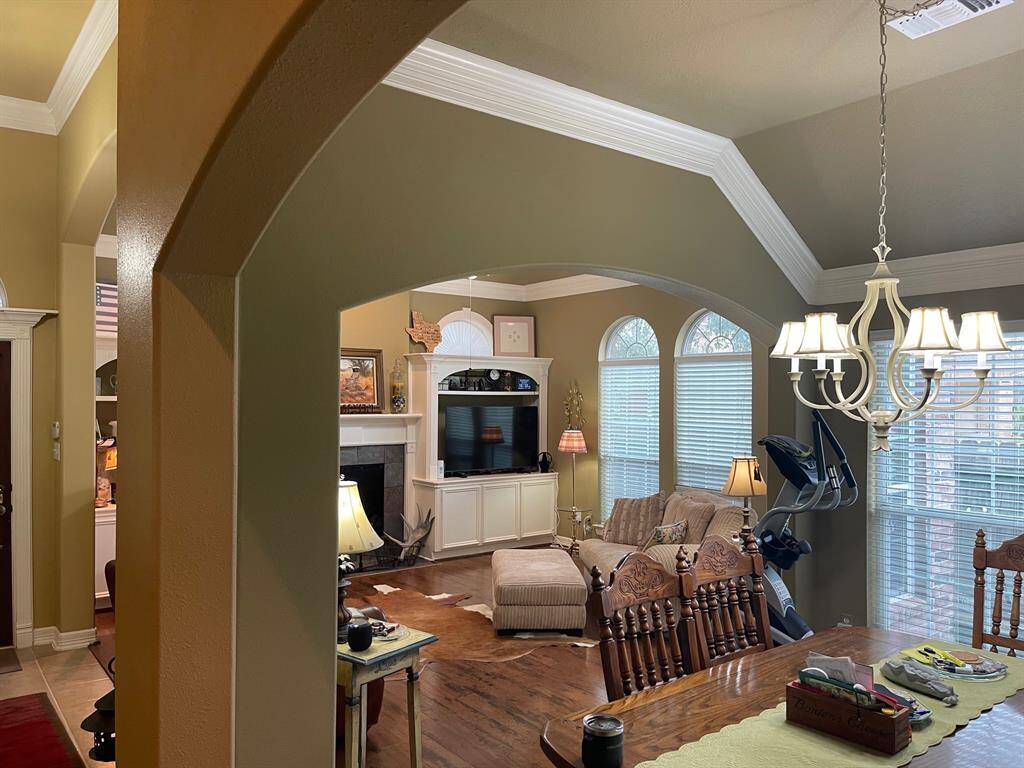 This home is very warm and cozy. Built in shelving and cabinets adjacent to the gas log fireplace.