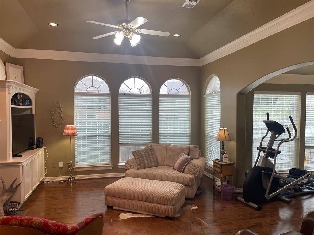 Living area flows into the dining room, open floor plan, no one ever misses the action.