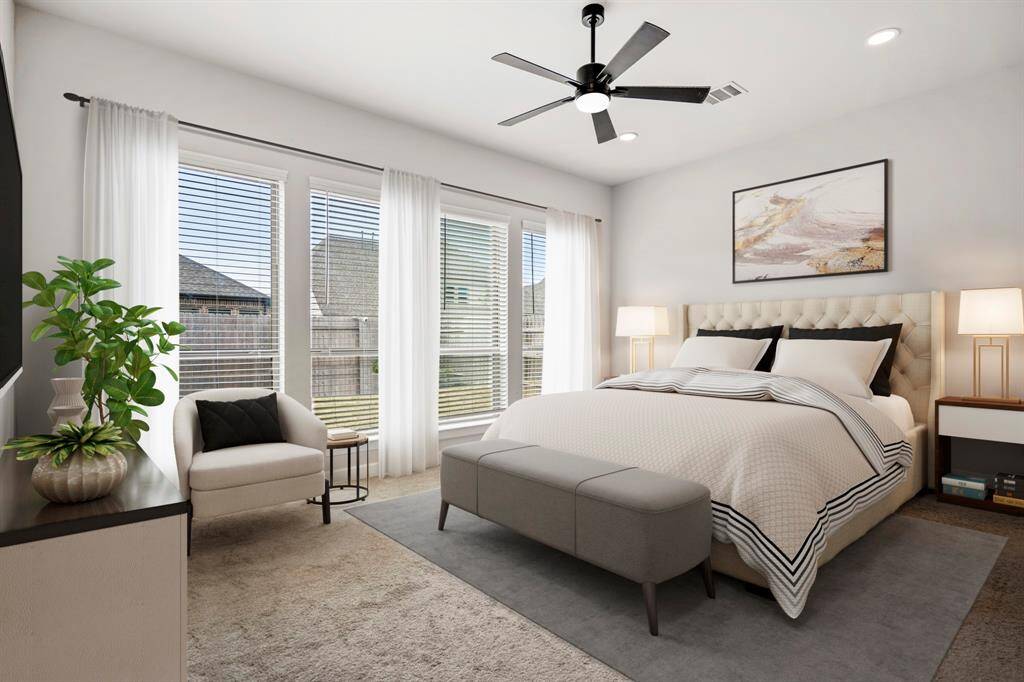 The primary bedroom welcomes you with bright natural light, high ceilings, plush carpet, and the perfect view of the serene yard. It sits at the back of the home offering additional privacy and easily fits a king size bed plus furniture!  *This room has been virtually staged