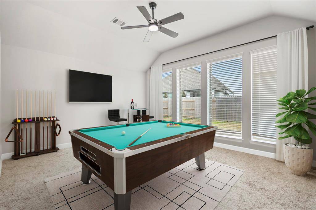 This spacious game room features plush carpet, a ceiling fan, and bright natural light—perfect for movie nights, game days, or just hanging out. Let the good times begin! *This room has been virtually staged